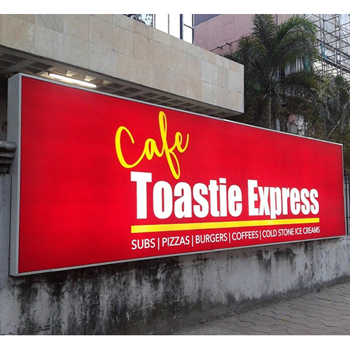 Glow sign board mounted on exterior wall